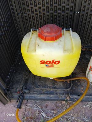 Sola backpack style weed sprayer and a handheld HDX pump weed sprayer