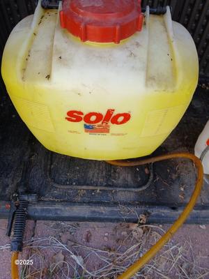 Sola backpack style weed sprayer and a handheld HDX pump weed sprayer