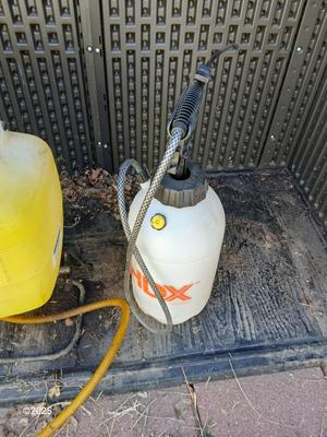 Sola backpack style weed sprayer and a handheld HDX pump weed sprayer
