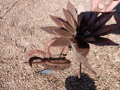 Handmade rustic yard art - flower and a horseshoe butterfly