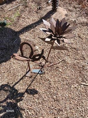 Handmade rustic yard art - flower and a horseshoe butterfly