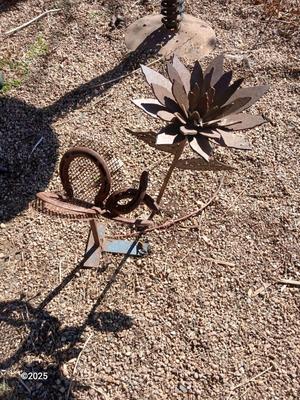 Handmade rustic yard art - flower and a horseshoe butterfly