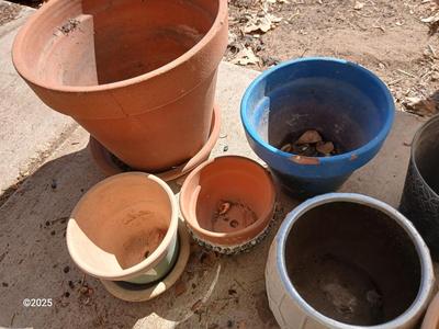 Assortment of small ceramic and terra cotta flowerpots - planters - Pots -