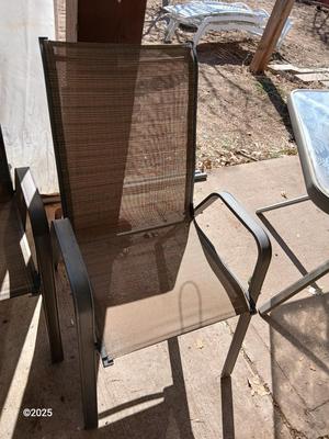 HUGE patio table with leaf imprint design on glass, 6 patio chairs and an umbrella stand