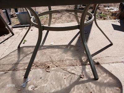 HUGE patio table with leaf imprint design on glass, 6 patio chairs and an umbrella stand