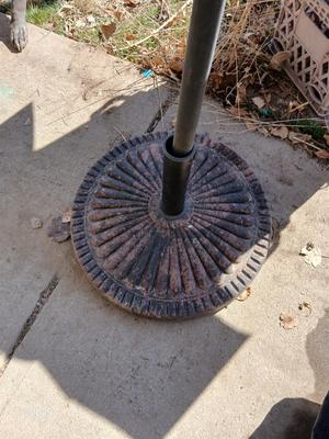HUGE patio table with leaf imprint design on glass, 6 patio chairs and an umbrella stand