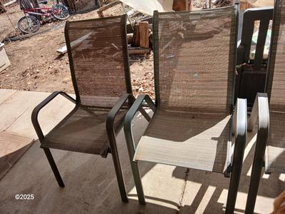 HUGE patio table with leaf imprint design on glass, 6 patio chairs and an umbrella stand