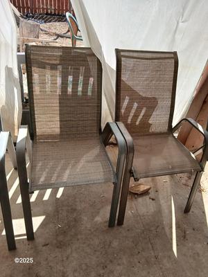 HUGE patio table with leaf imprint design on glass, 6 patio chairs and an umbrella stand