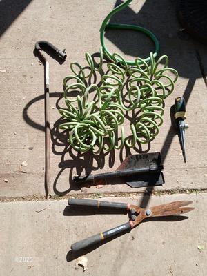 Garden hose, sprinklers, anda few handtools