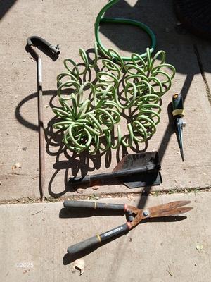 Garden hose, sprinklers, anda few handtools