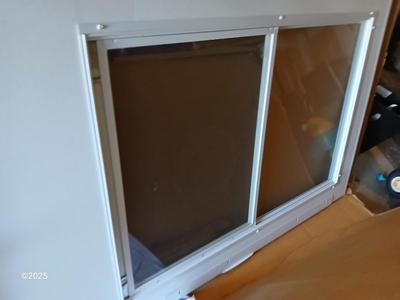Brand new never installed EMCO K900 Series Storm door with Large pet entry system 36" x 80"