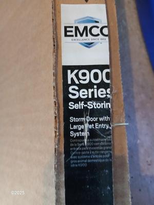 Brand new never installed EMCO K900 Series Storm door with Large pet entry system 36" x 80"