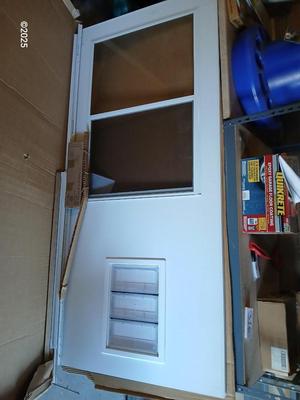 Brand new never installed EMCO K900 Series Storm door with Large pet entry system 36" x 80"