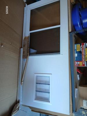 Brand new never installed EMCO K900 Series Storm door with Large pet entry system 36" x 80"