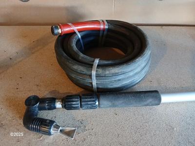 Brand new 25-foot garden hose with gutter cleaning attachment