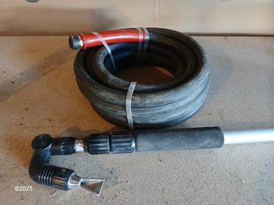 Brand new 25-foot garden hose with gutter cleaning attachment