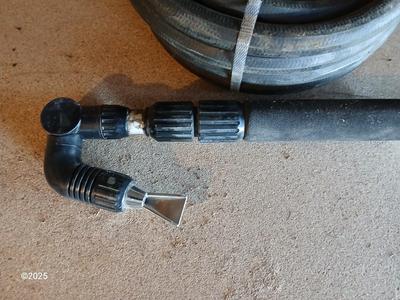 Brand new 25-foot garden hose with gutter cleaning attachment