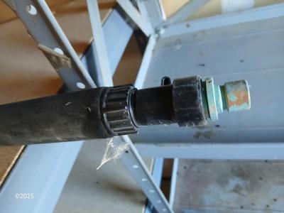 Brand new 25-foot garden hose with gutter cleaning attachment
