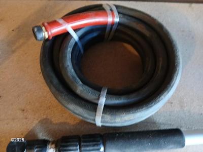 Brand new 25-foot garden hose with gutter cleaning attachment