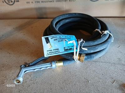 New 25-foot garden hose with spray attachment and two extension cords and timer