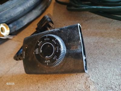 New 25-foot garden hose with spray attachment and two extension cords and timer