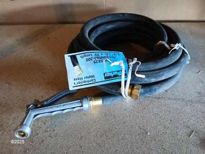 New 25-foot garden hose with spray attachment and two extension cords and timer
