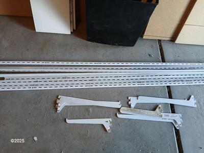 Vertical wall shelf brackets and rails with wooden shelves and a new closet organizing system