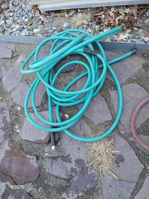 Two garden hoses with a sprinkler