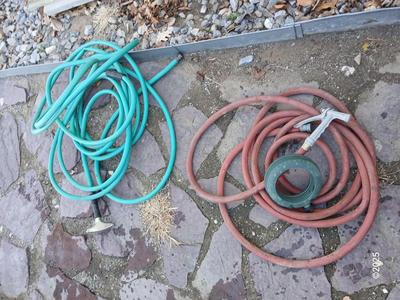 Two garden hoses with a sprinkler