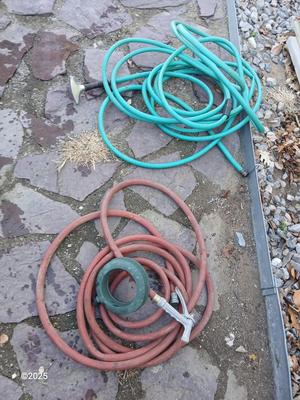 Two garden hoses with a sprinkler