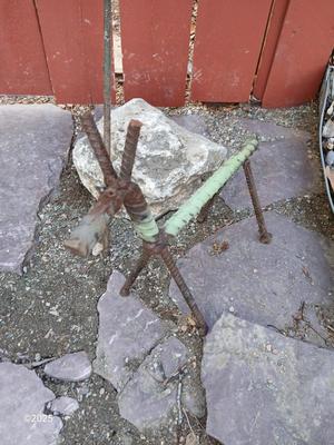 Handmade metal flower and stick horse made from rebar