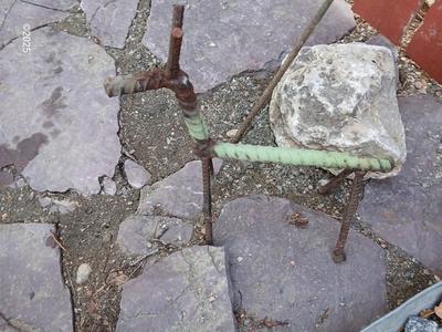 Handmade metal flower and stick horse made from rebar