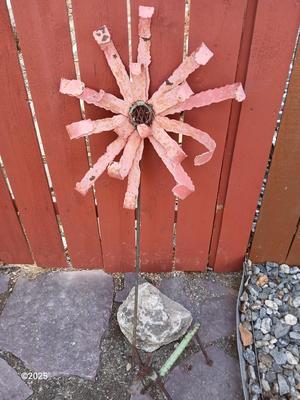 Handmade metal flower and stick horse made from rebar