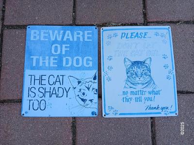 Two light metal / tin humorous signs