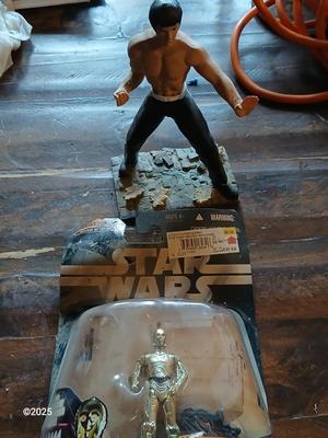 Star wars C-3PO Figure and a figure of Bruce Lee