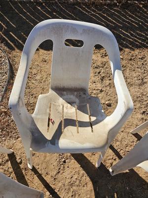 Three plastic patio chairs