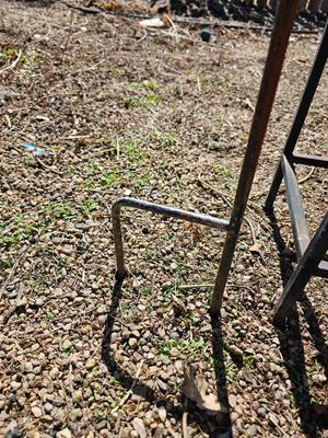 Rustic yard / garden art flower with small rusty table - and a shepherd's hook plant hanger