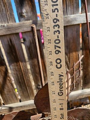 Rustic yard / garden art flower with small rusty table - and a shepherd's hook plant hanger