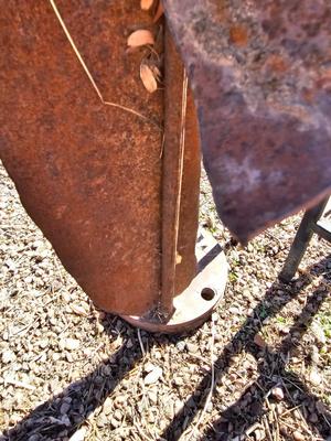 Rustic yard / garden art flower with small rusty table - and a shepherd's hook plant hanger