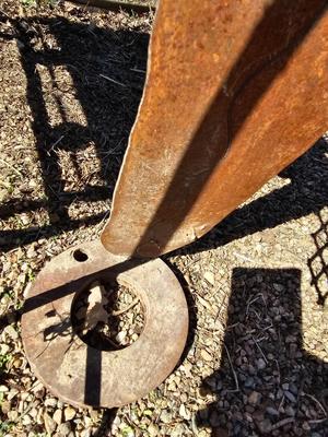 Rustic yard / garden art flower with small rusty table - and a shepherd's hook plant hanger