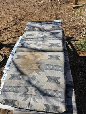 Three southwestern designed chair cushions