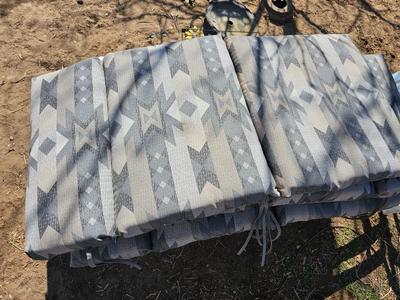 Three southwestern designed chair cushions