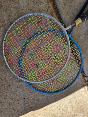 Badminton racquets - birdie - net - and a dart board