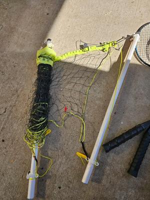 Badminton racquets - birdie - net - and a dart board