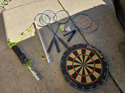 Badminton racquets - birdie - net - and a dart board