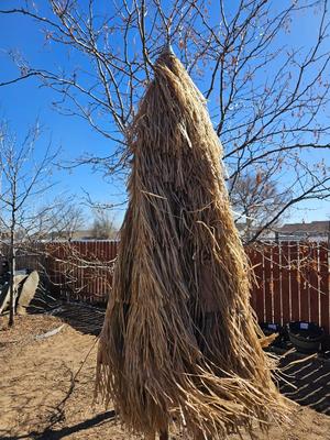 Tiki straw umbrella with stand and three rolls of bamboo wall art