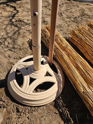 Tiki straw umbrella with stand and three rolls of bamboo wall art