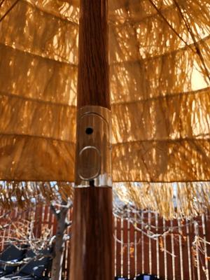 Tiki straw umbrella with stand and three rolls of bamboo wall art