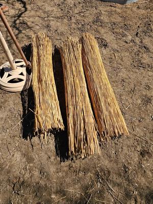 Tiki straw umbrella with stand and three rolls of bamboo wall art