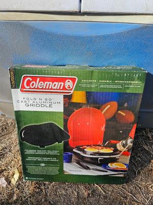 Rubbermaid cooler and a new Coleman griddle and a small umbrella